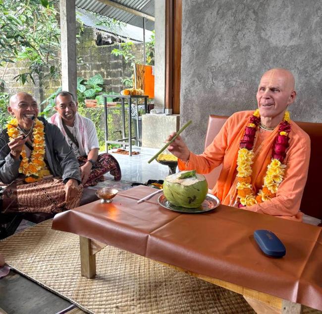 Drinking Cocunut water with lotus stem in INDONESIA